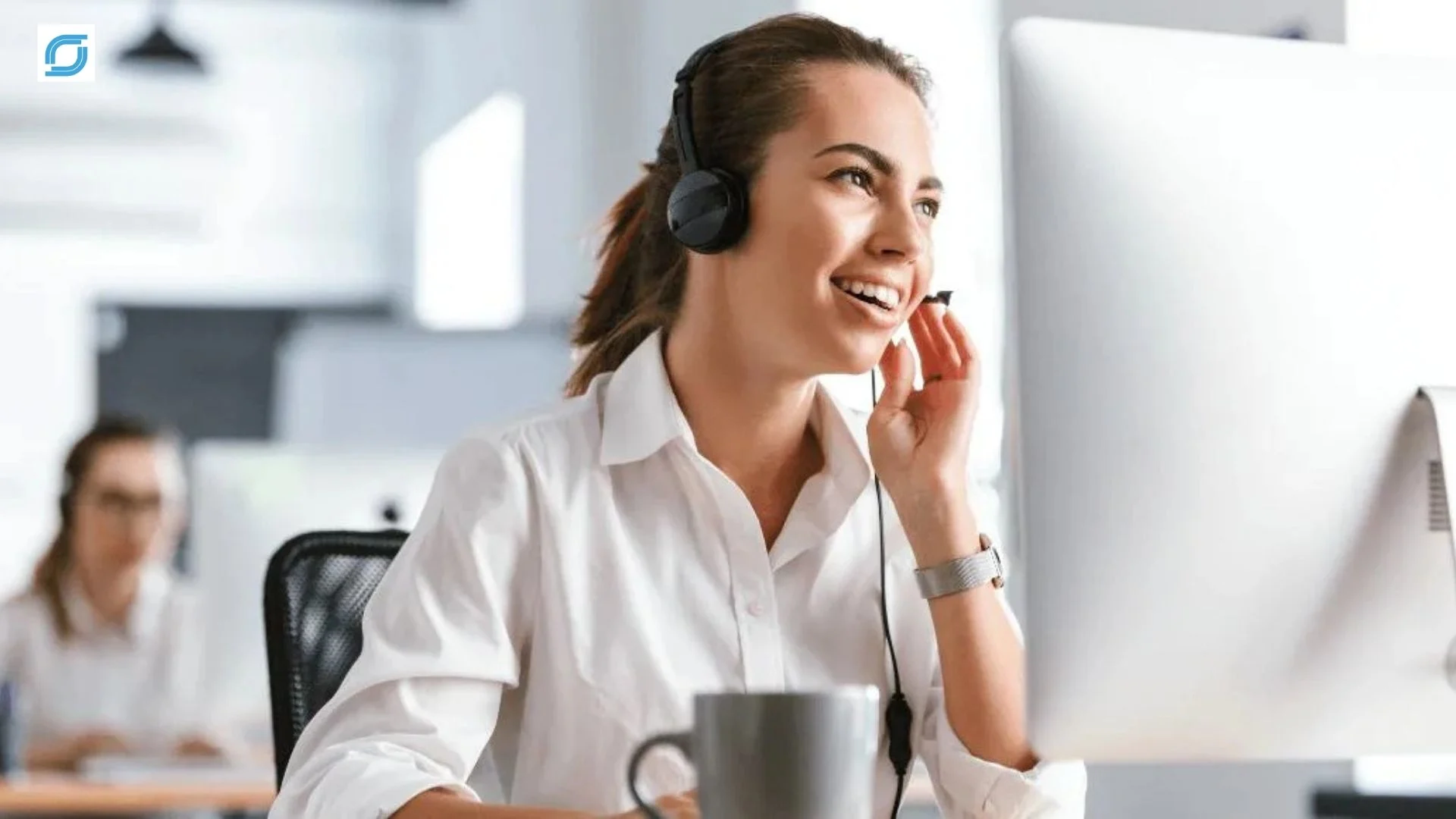 Tag Telecom customer support agent assisting a customer in a modern call center