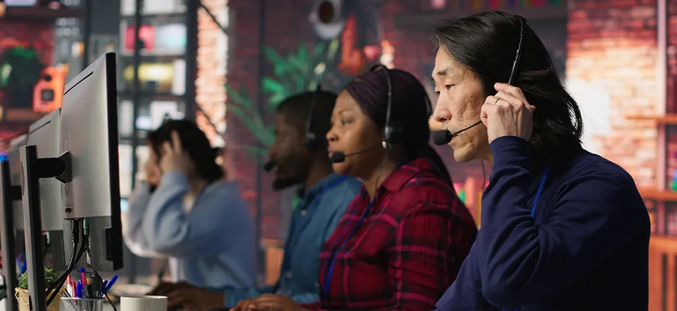 MVNO customer support outsourcing team assisting mobile subscribers in a call center environment