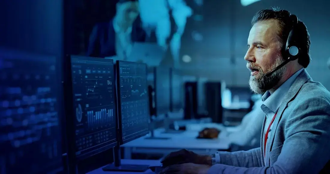 Telecom technical support engineer monitoring network performance and resolving customer connectivity issues in a telecom NOC environment